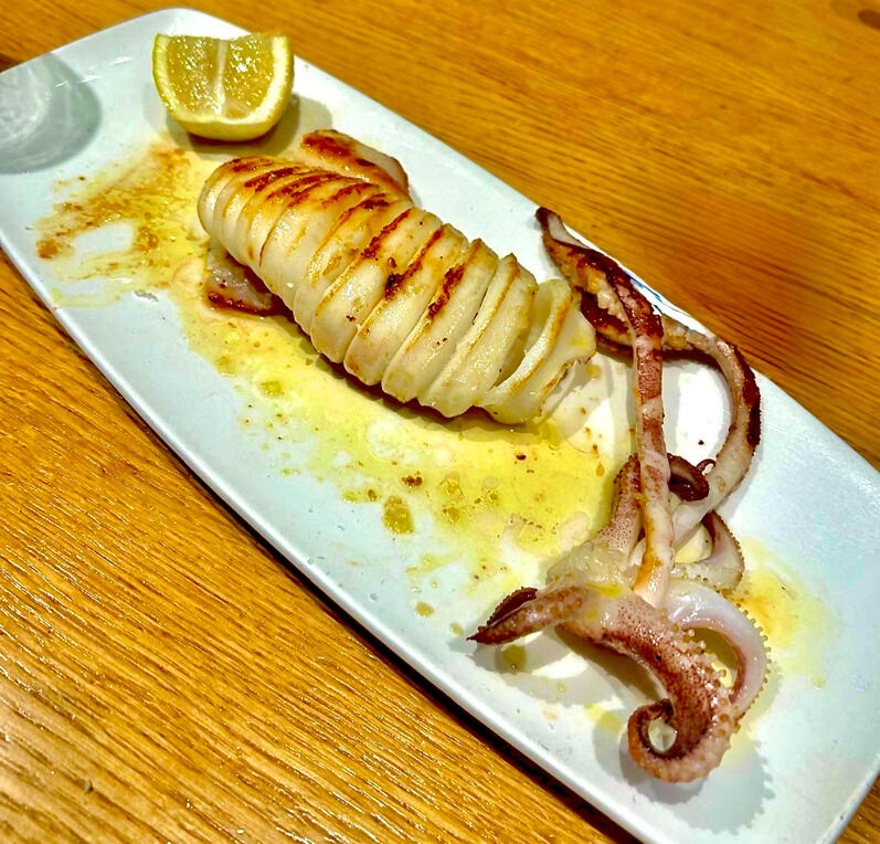 🦑 Grilled squid A squeeze of lemon, a drizzle of olive oil.